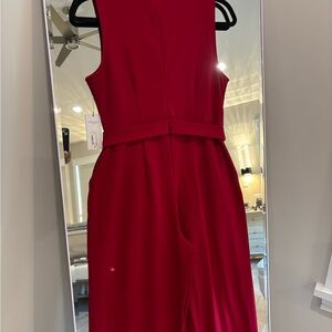 Gorgeous mock neck jumpsuit with chain front detail.